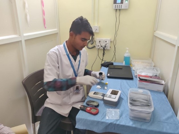 Male nurse conducting blood testing work
