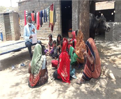 Group photo of Community meeting at Dholi Village, India