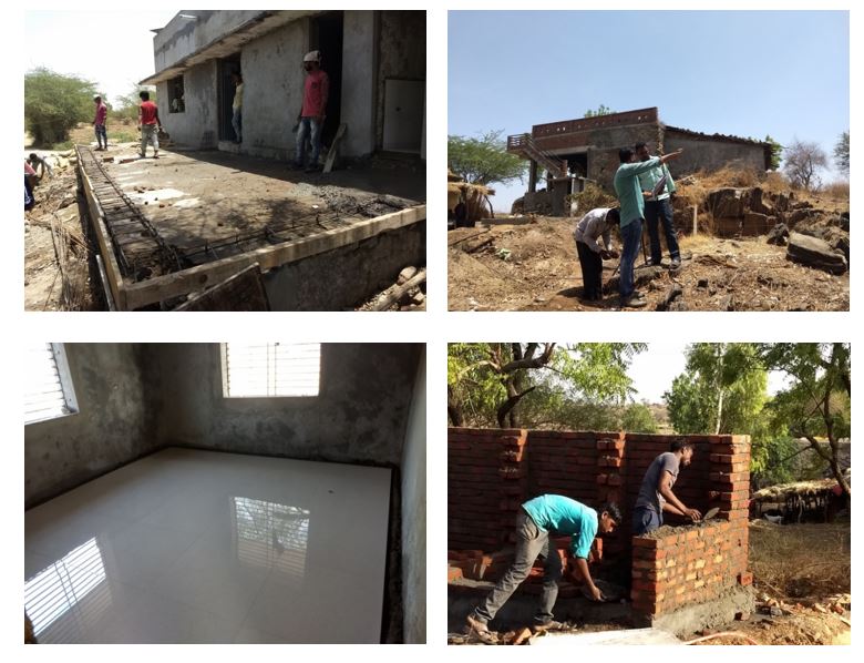 Workers building walkway outside THWC. laying bricks and installing new floor