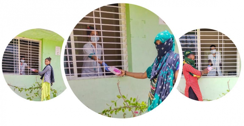 Three women at window dressed in colorful sarongs - SHE Program